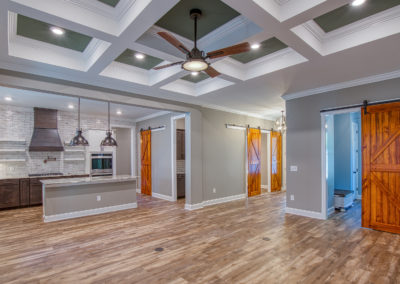 Great room with coffered ceilings and barn doors