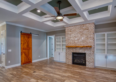 Great room with built-in custom cabinets and a gas fireplace